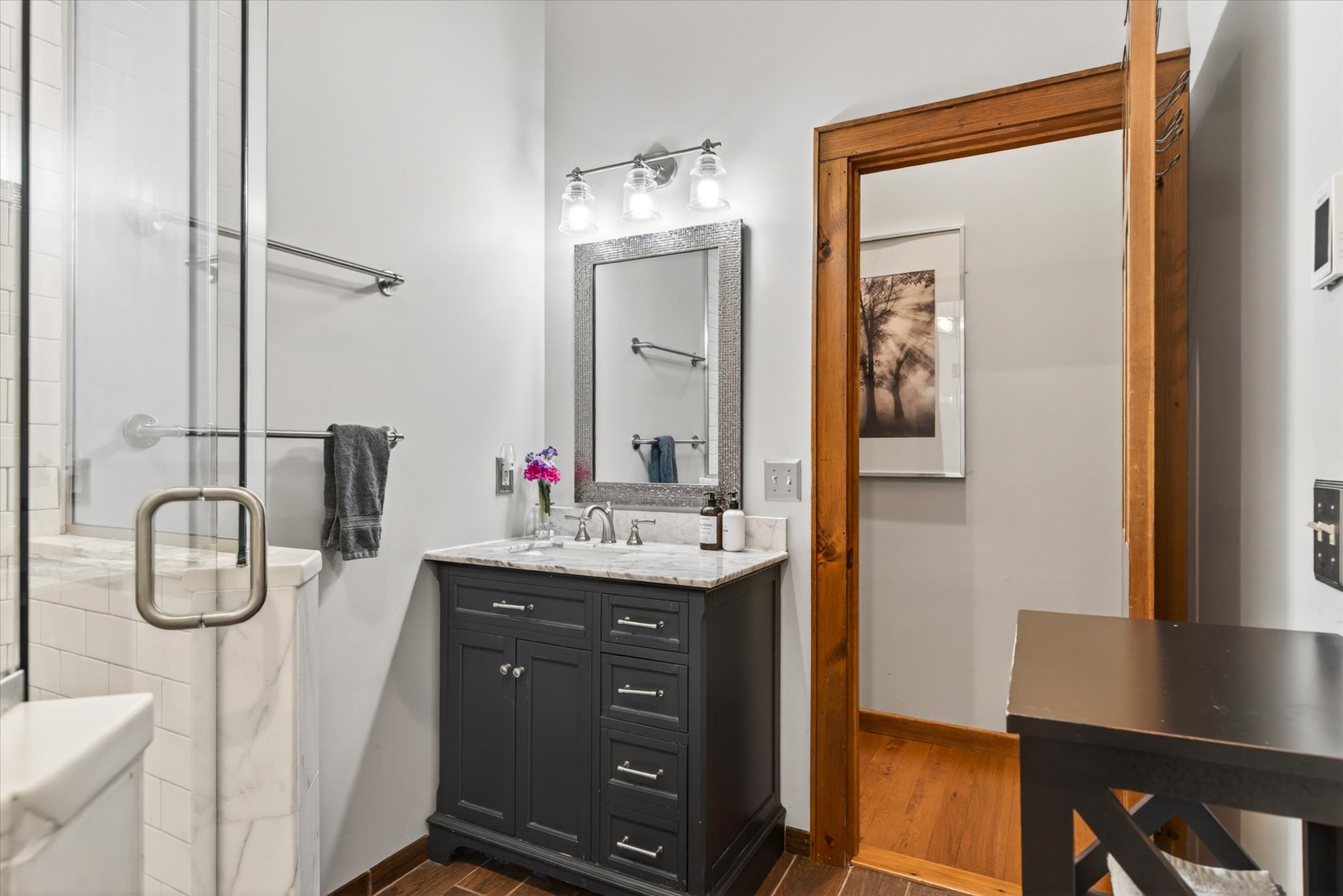 Lower bathroom vanity with marble countertop and spa-quality toiletries — Slippery Slope Chalet