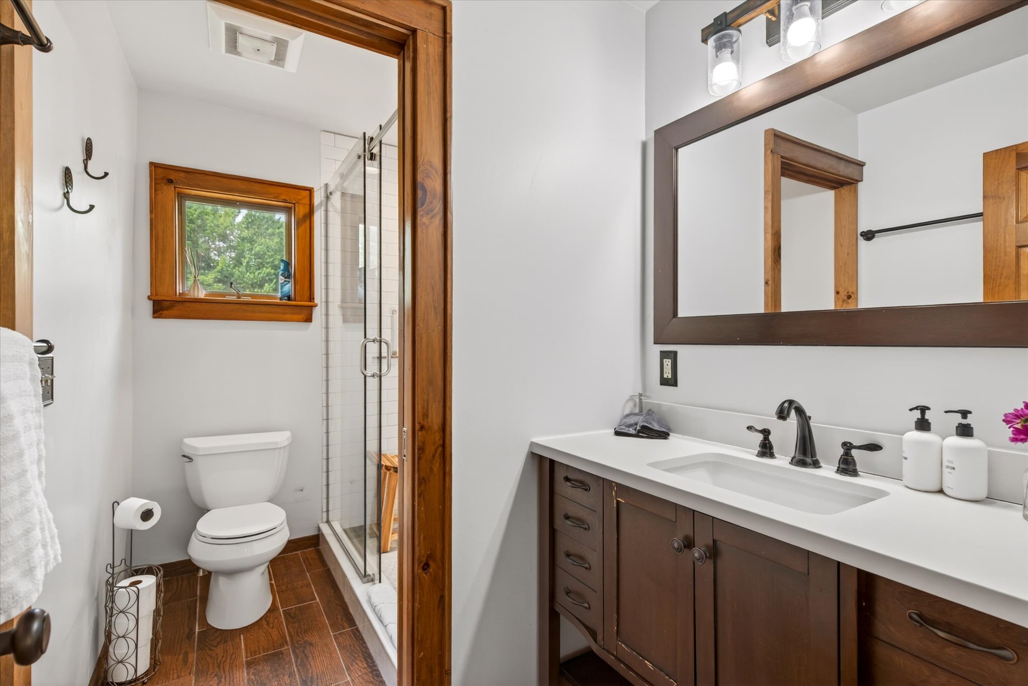 Upper bathroom with rain shower, Waterpik, and spa-quality bath and body products — Slippery Slope Chalet