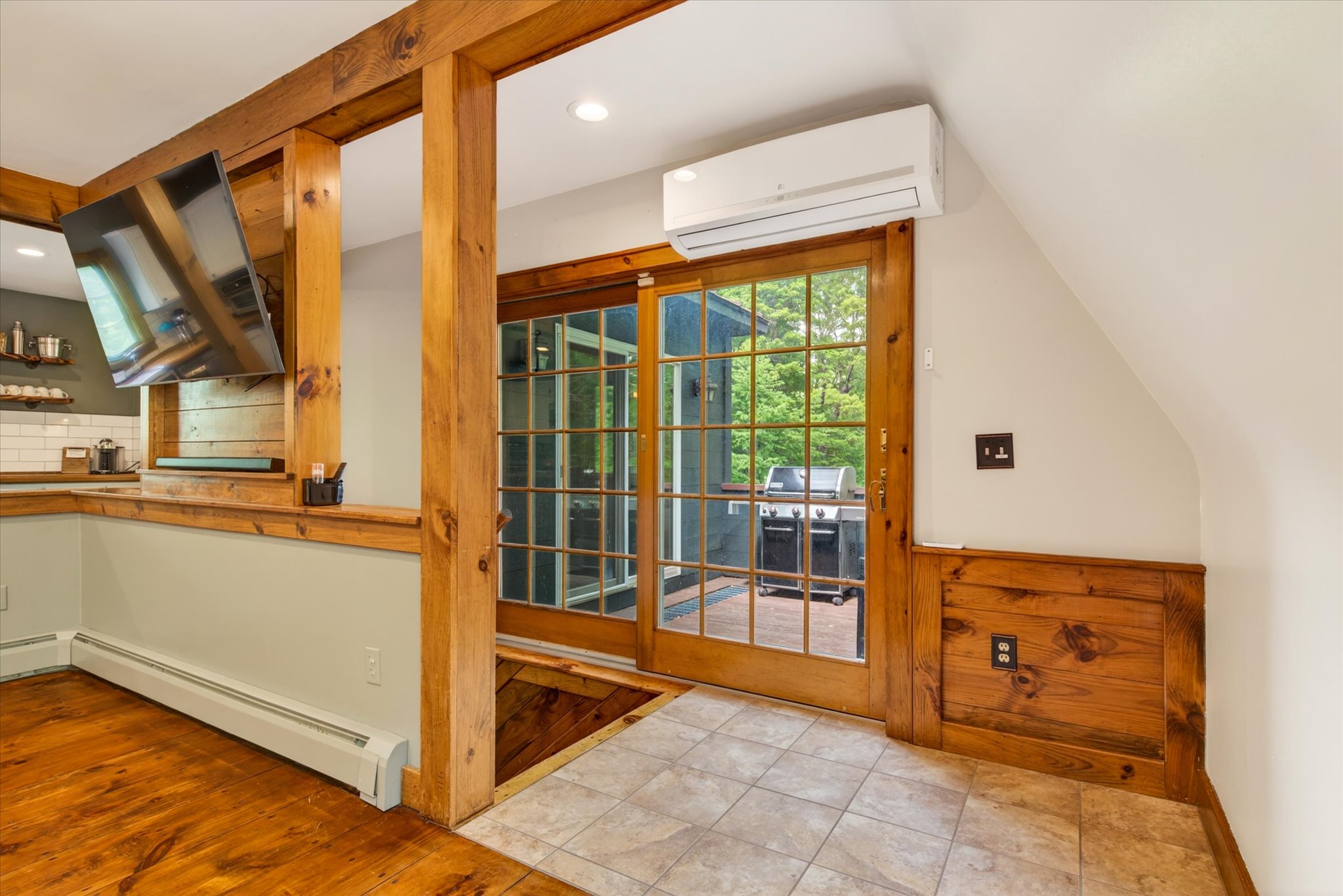 View from dining area to deck through sliding door — Slippery Slope Chalet