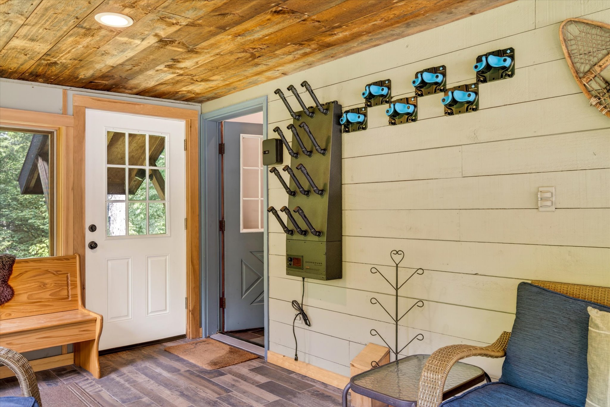 Heated sunroom entry with ski rack and boot dryer — Slippery Slope Chalet